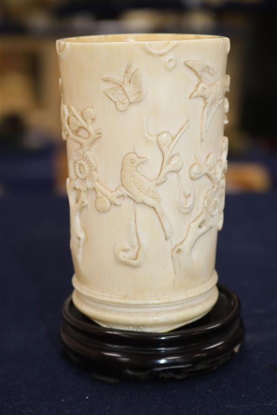 A Chinese ivory brush pot carved with prunus, calligraphy, etc. and an ivory seal H 10.5cm & 4cm